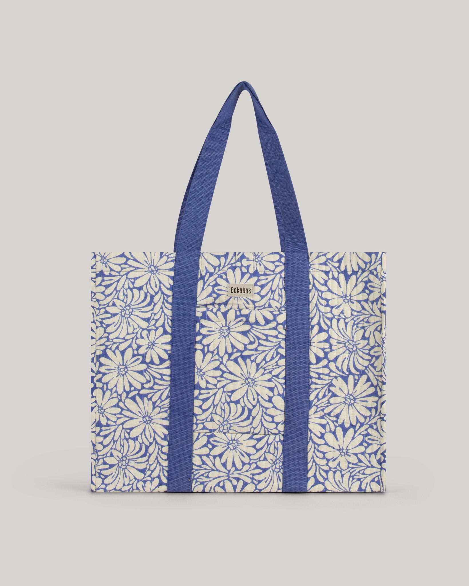 A bolsa tote em tecido acolchoado Daisy azul