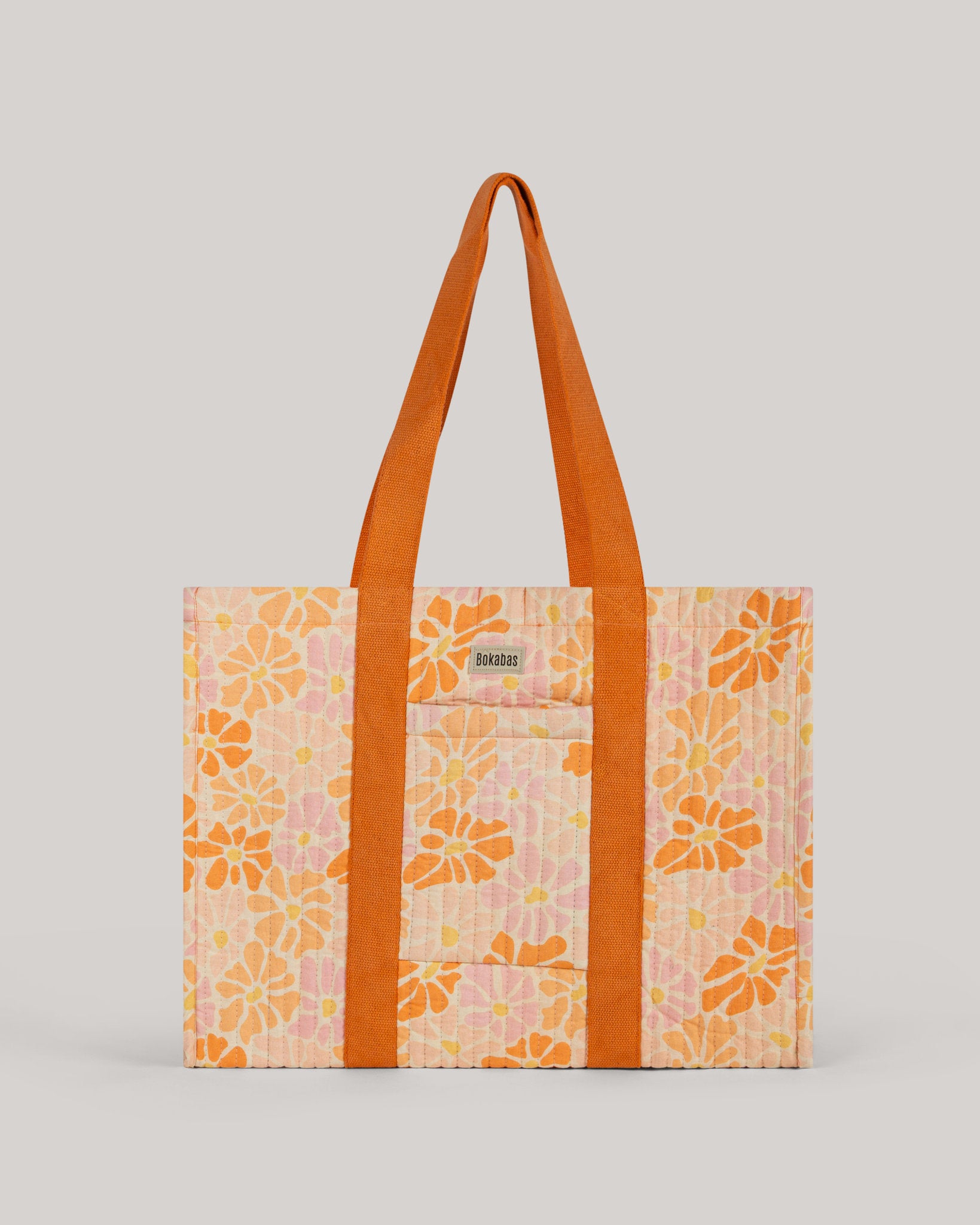 A bolsa tote em tecido acolchoado Peachy laranja