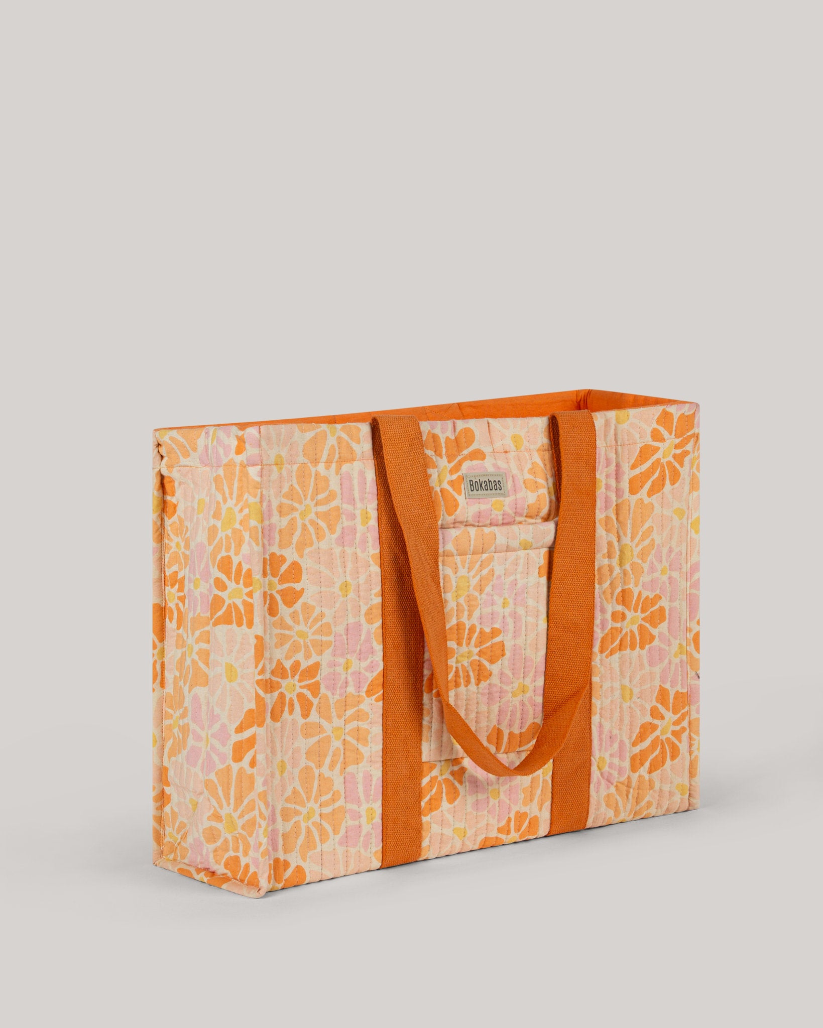 A bolsa tote em tecido acolchoado Peachy laranja