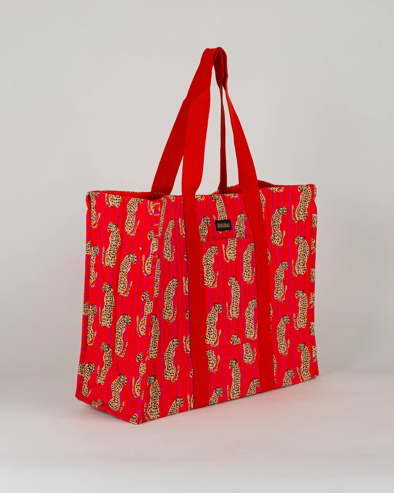 Sac cabas en tissu matelassé Bokabas, imprimé Guépard rayé orange et rose, vue de trois-quarts