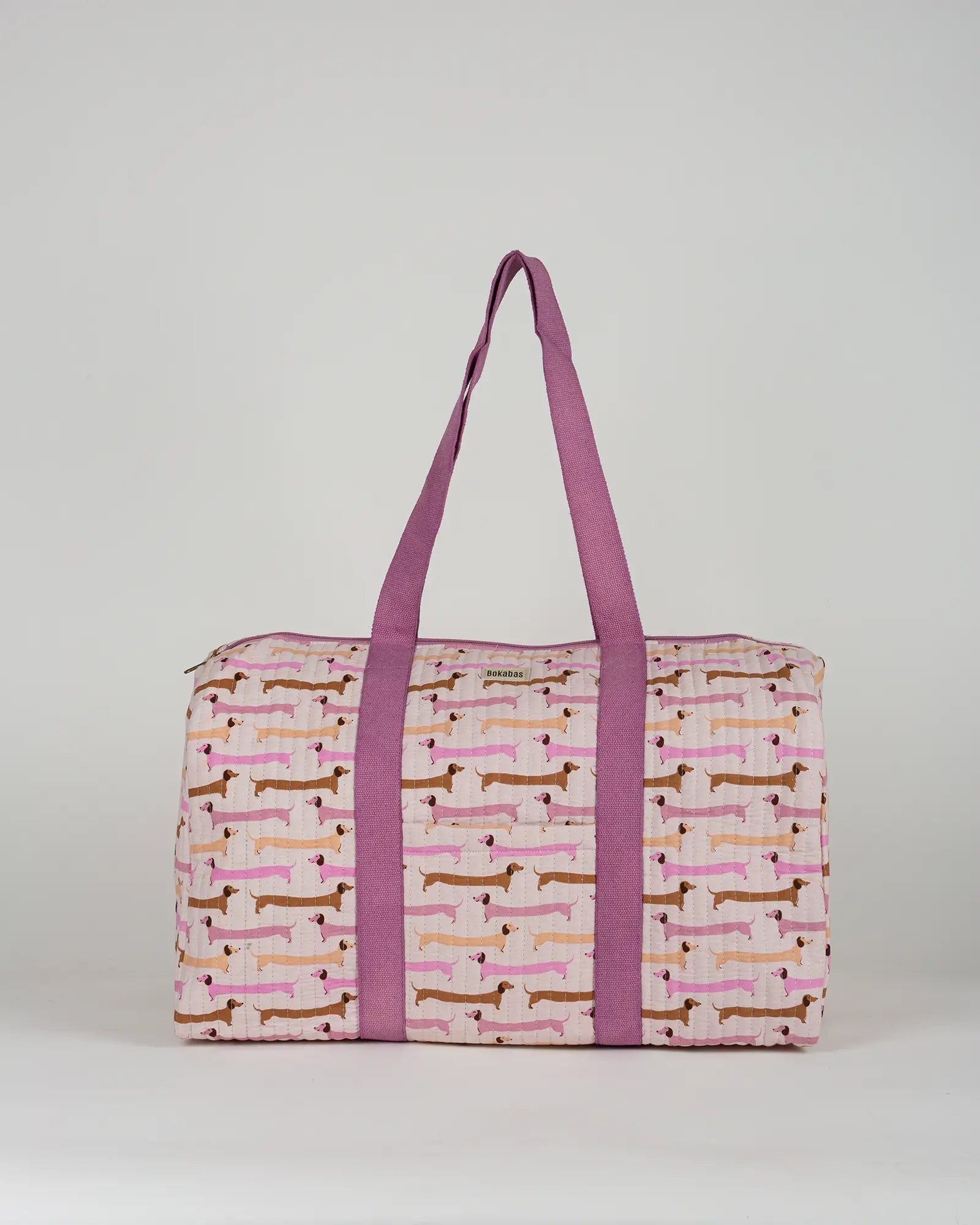 Sac week-end matelassé Bokabas, imprimé Saucisse chien teckel rose et violet, vue de face