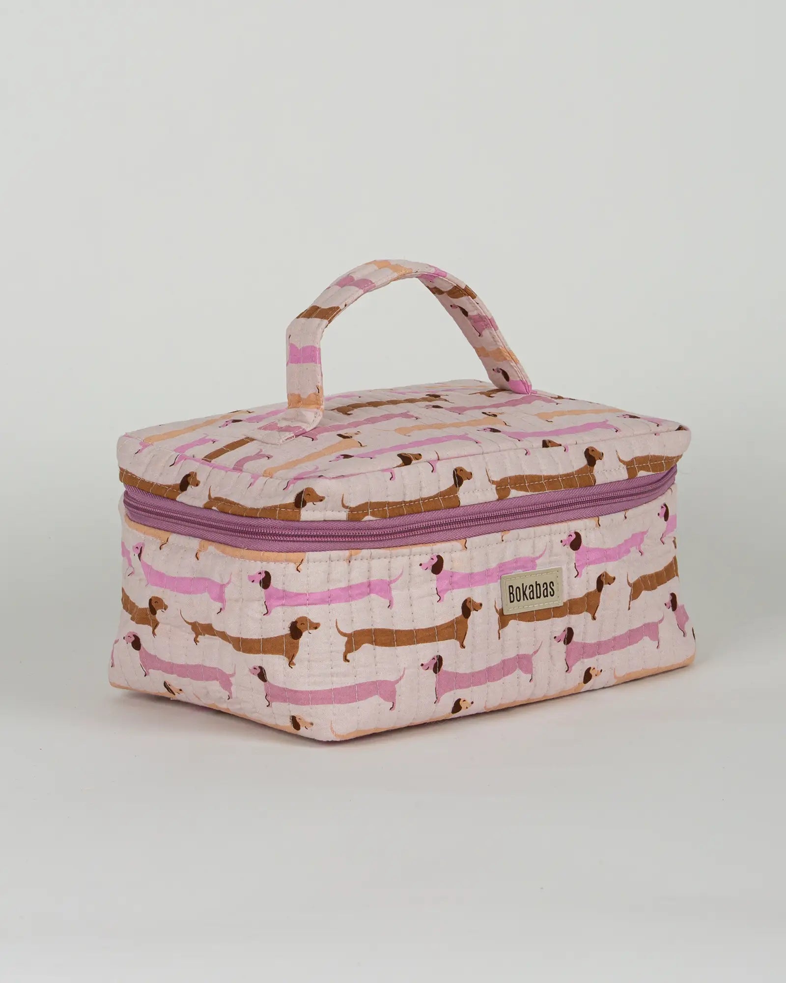 Trousse vanity maquillage matelassée Bokabas, imprimé Saucisse chien teckel rose et violet, vue de trois-quarts